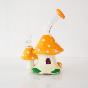 Cottage bong, orange mushroom house glass bong with red toadstools, angled view
