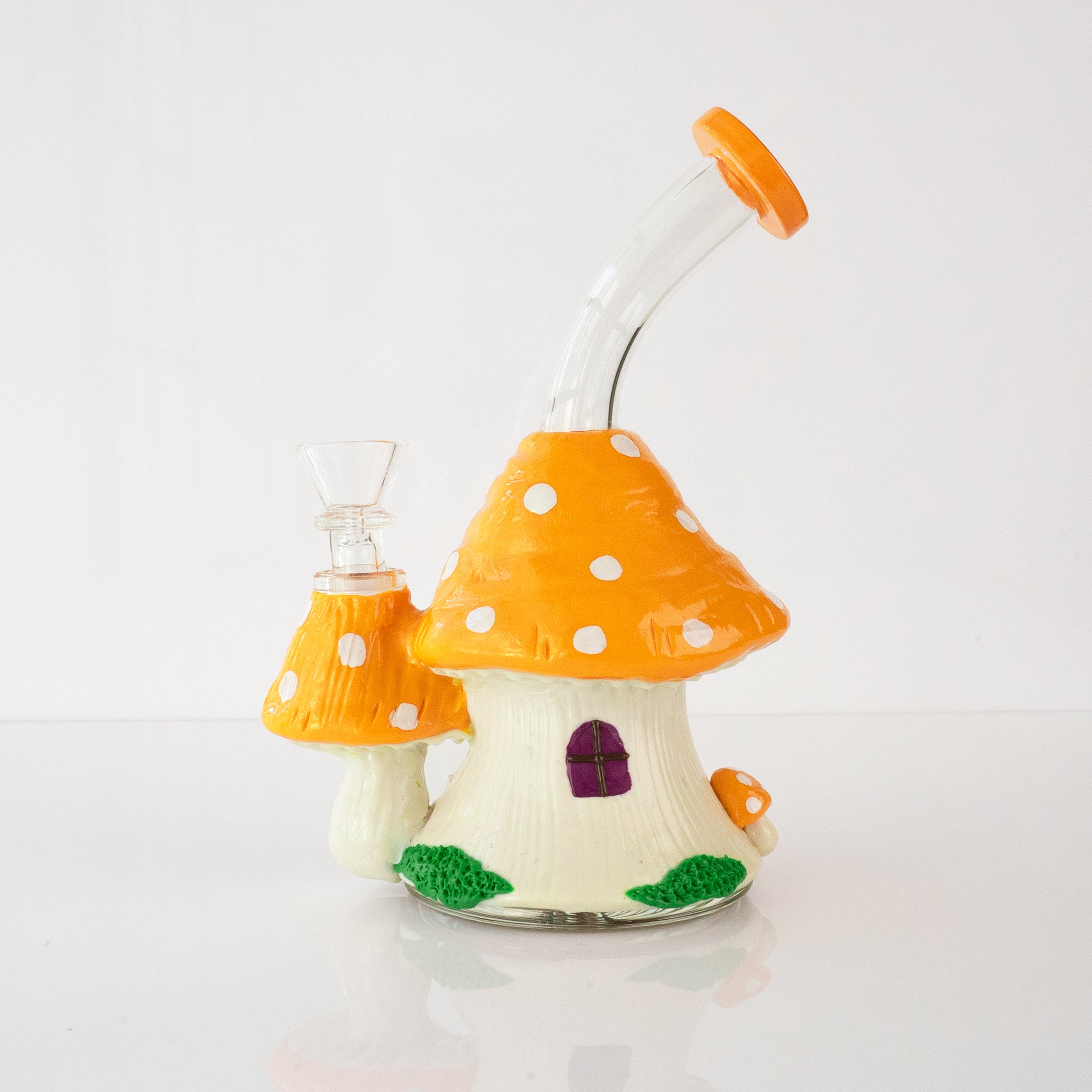 Cottage bong, orange mushroom house glass bong with red toadstools, angled view