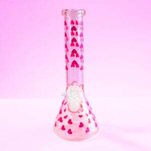 Love Her Madly pink hearts beaker bong by Cannabitches, glass bong with heart pattern, side view