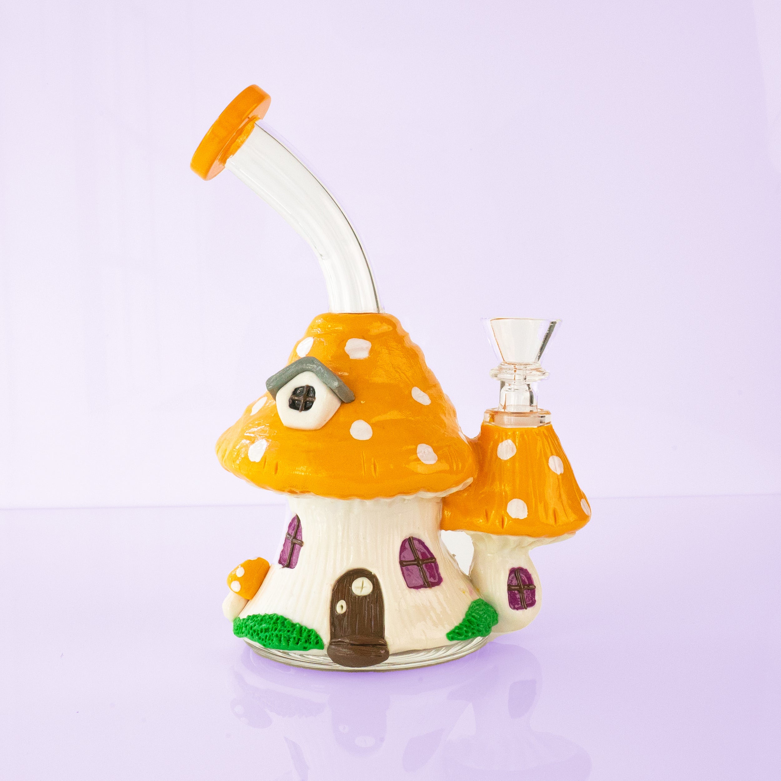 Cottage Bong, orange mushroom house glass bong with spotted cap on purple backdrop