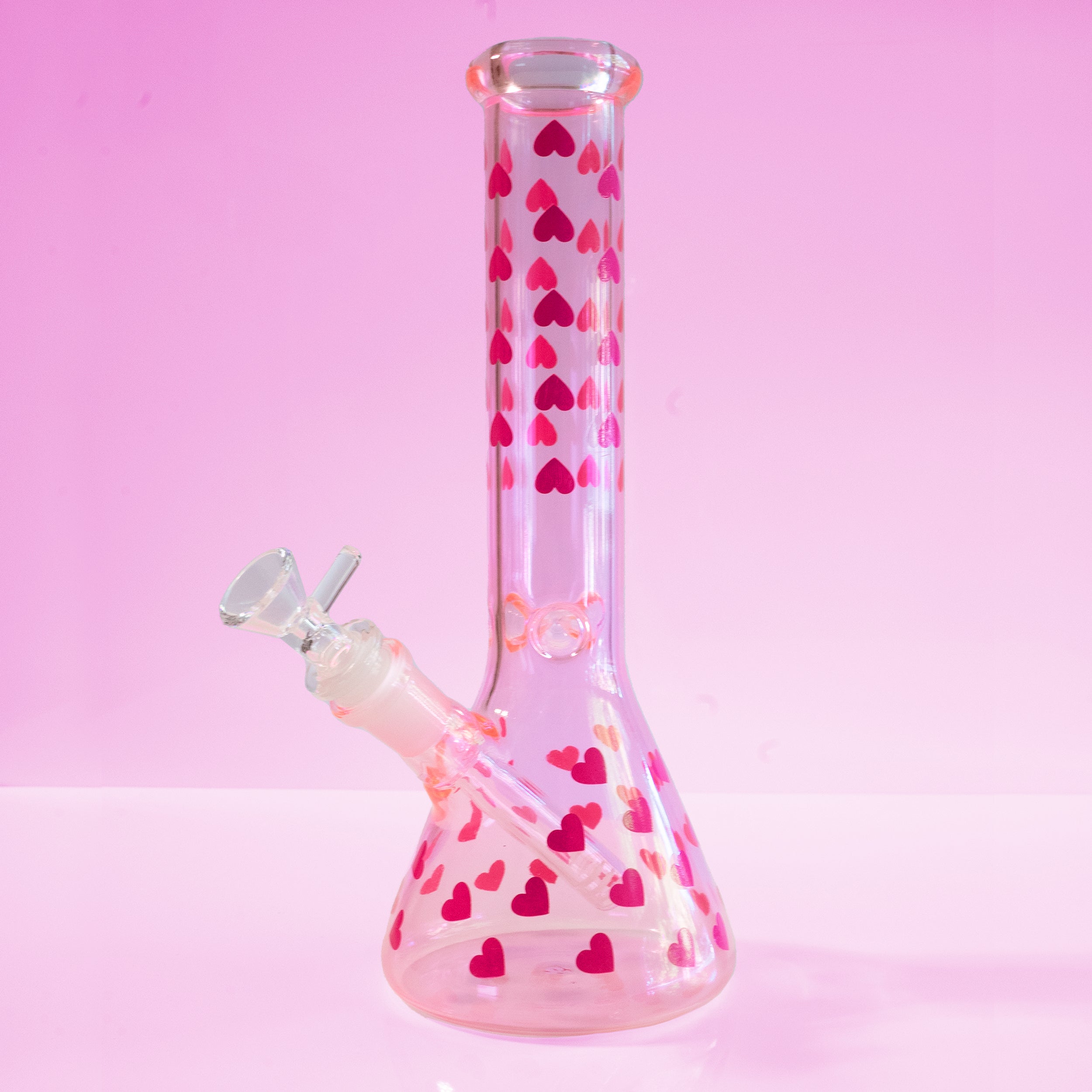 Love Her Madly pink hearts beaker bong by Cannabitches, clear glass with pink heart pattern
