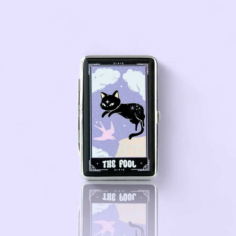 The Fool tarot card stash case by Cannabitches, lavender case with black cat art