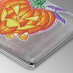 Pumpkin King stash case by Tarryn Ann, close-up of the carved jack-o-lantern artwork