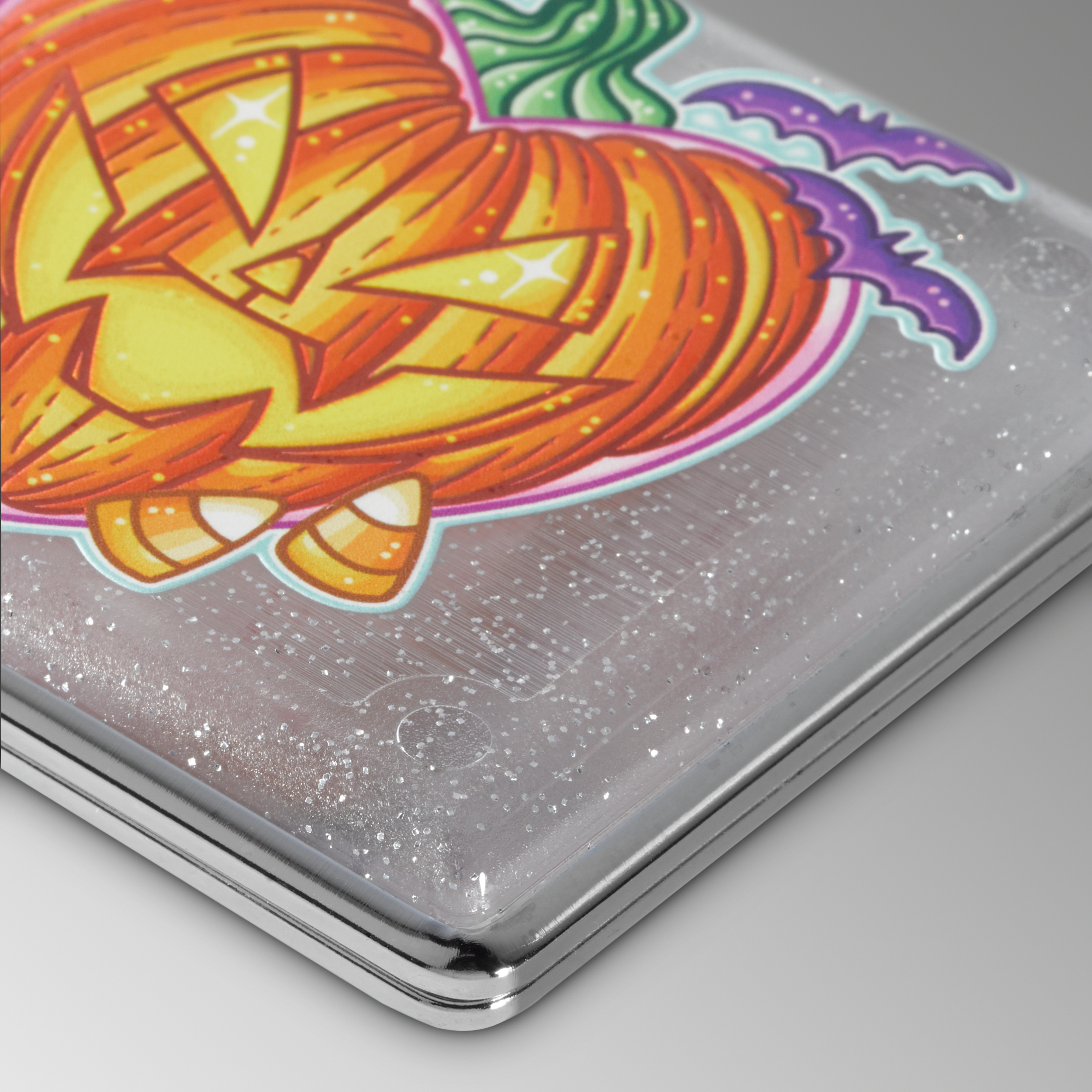 Pumpkin King stash case by Tarryn Ann, close-up of the carved jack-o-lantern artwork