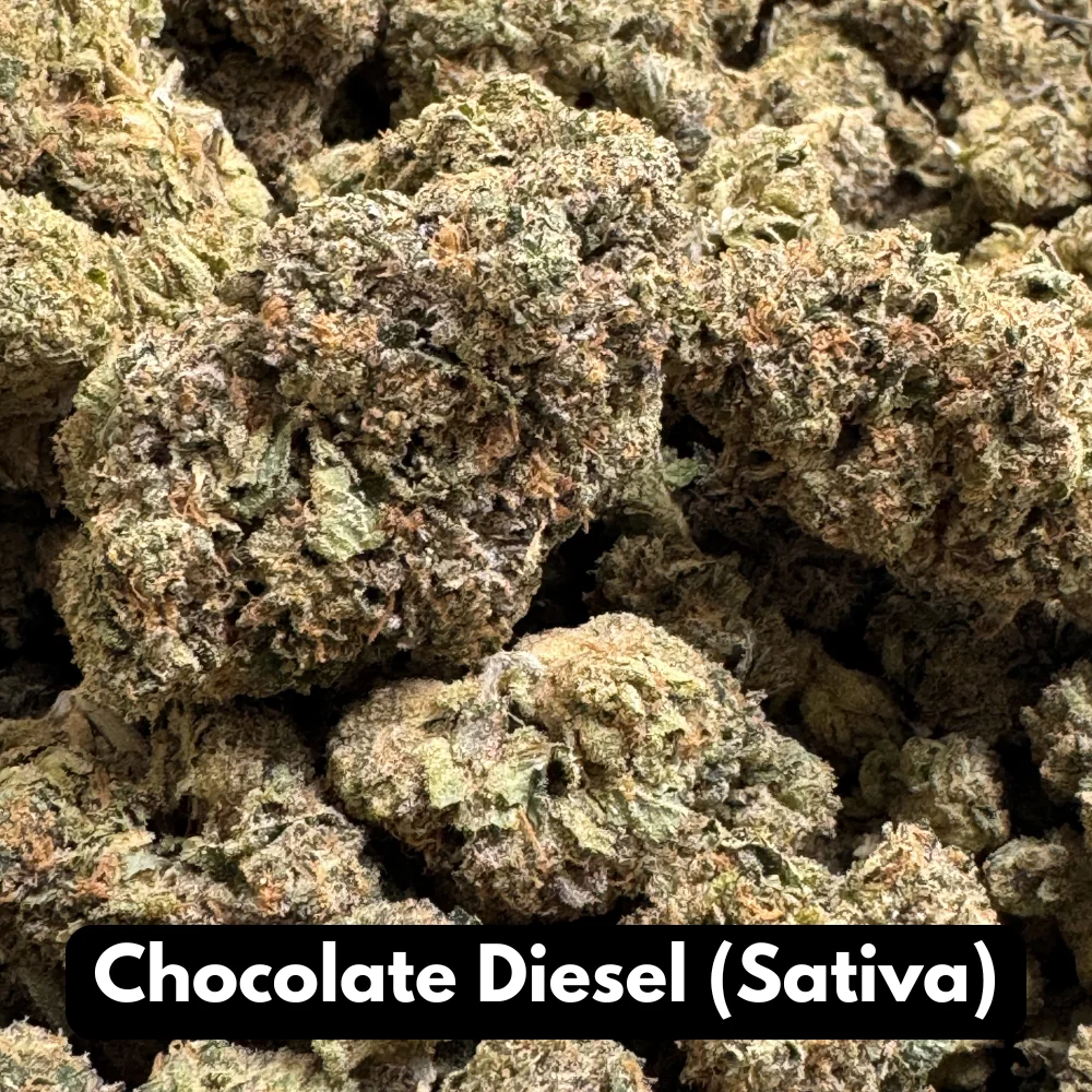 Bulk pile of Chocolate Diesel sativa THCA flower buds in macro close-up