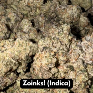 Bulk pile of Zoinks indica THCA flower buds with orange pistils in macro view